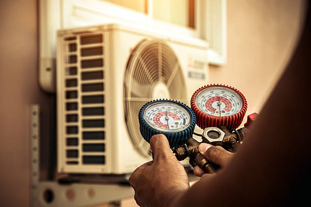 Professional Heat Pump Repair technician working in Pineville, SC